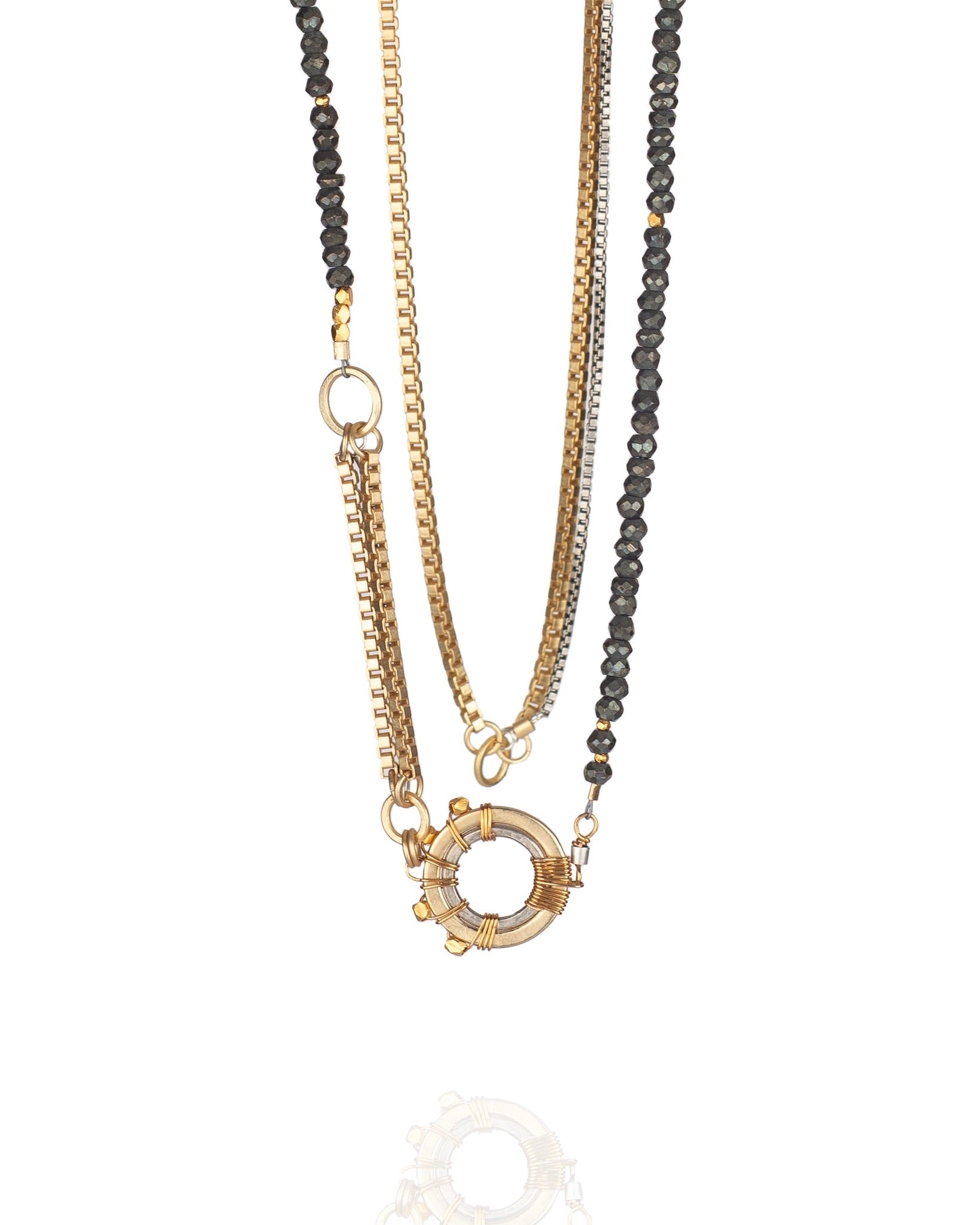 layered mixed metal necklace with faceted pyrite and multiple chain strands