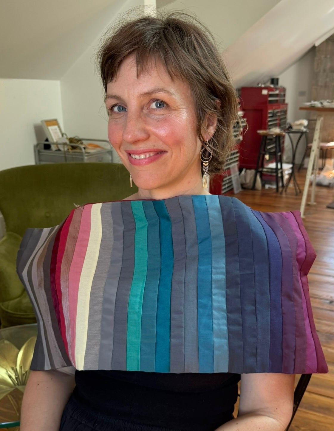 Woman wearing International Image Institute Muted drape in Sara Silvio mixed metal earrings and palette-aligned lipstick during color analysis session — The Foundation