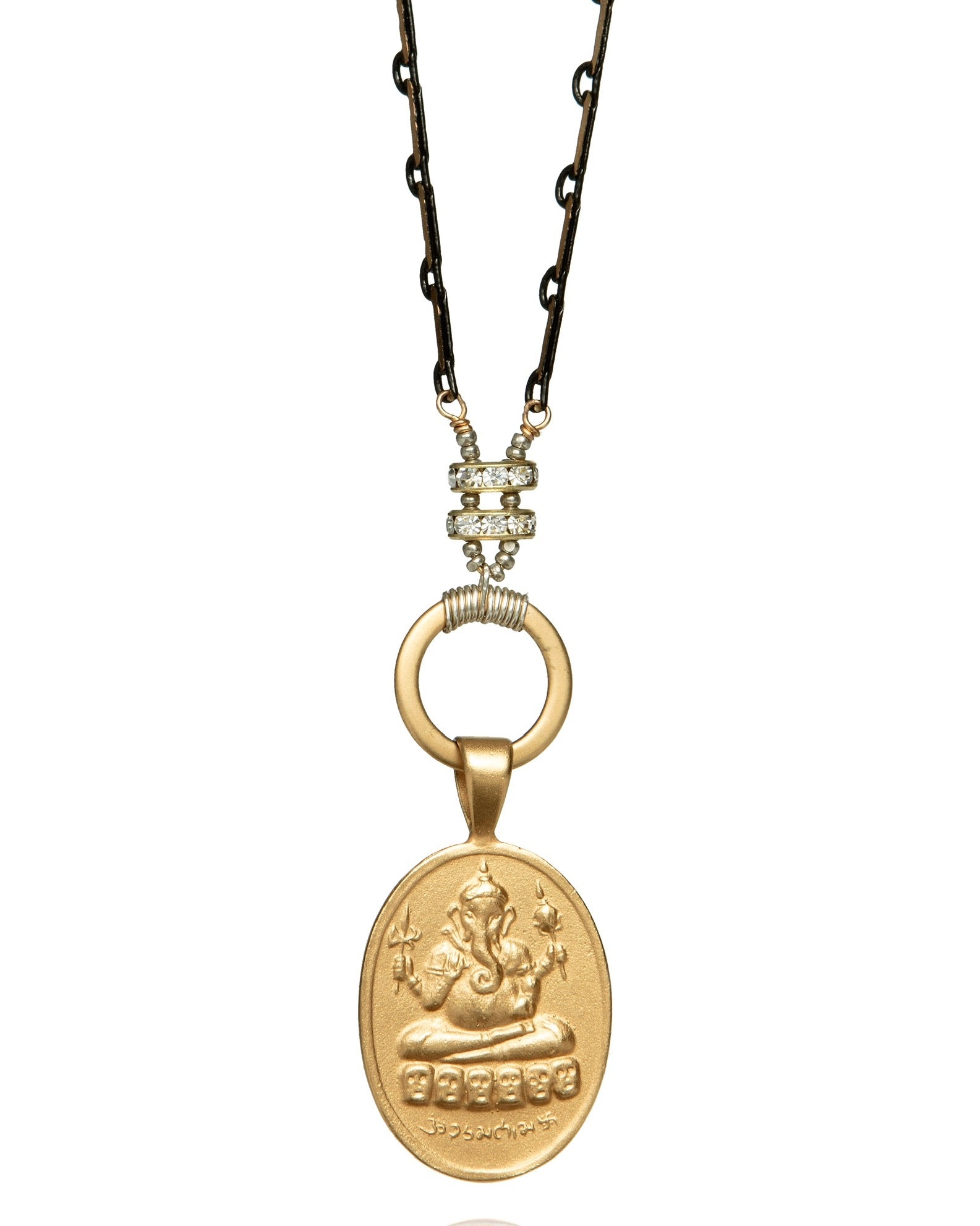 gold ganesh pendant necklace on black and gold vintage chain