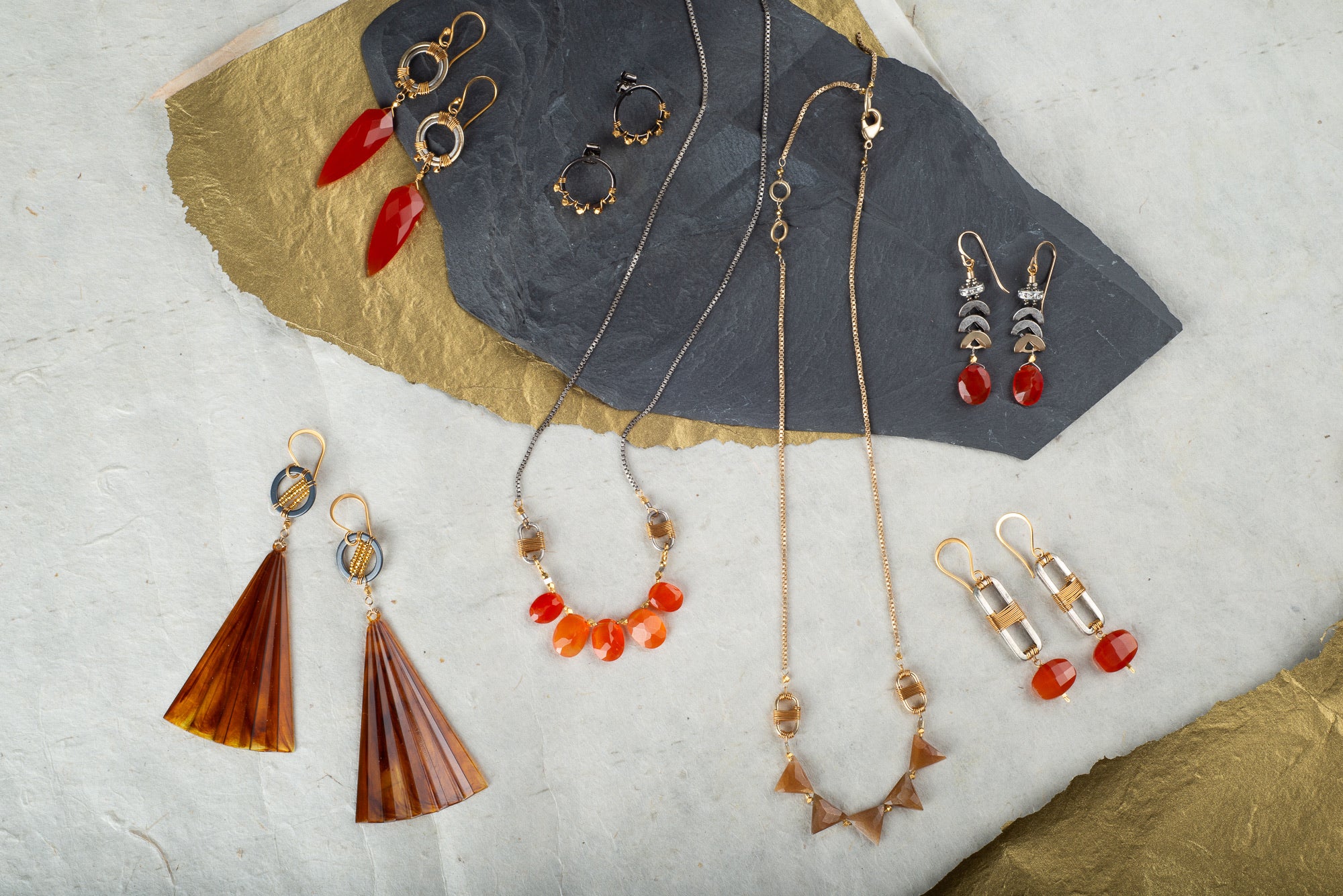collection of carnelian, tortoise and rutilated quartz pieces